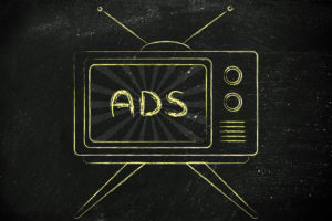 tv ads and mass media communication: old style television with text Ads