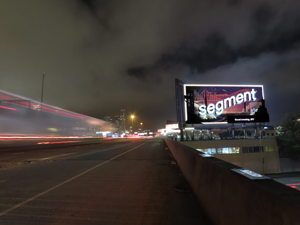 night time photo of "segment" branded billboard