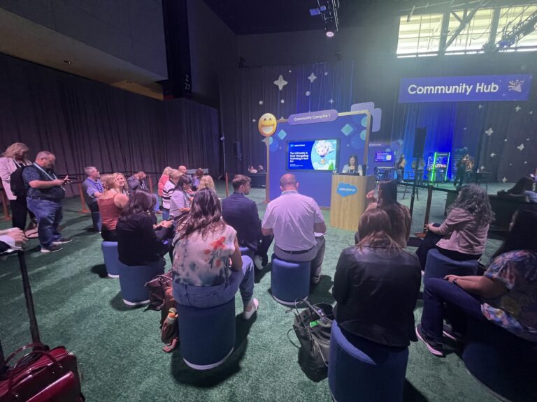 Emilie Sanders Lee, EVP of Global Analytics + Media Operations at Just Global attends a breakout session at Salesforce CNX 2025
