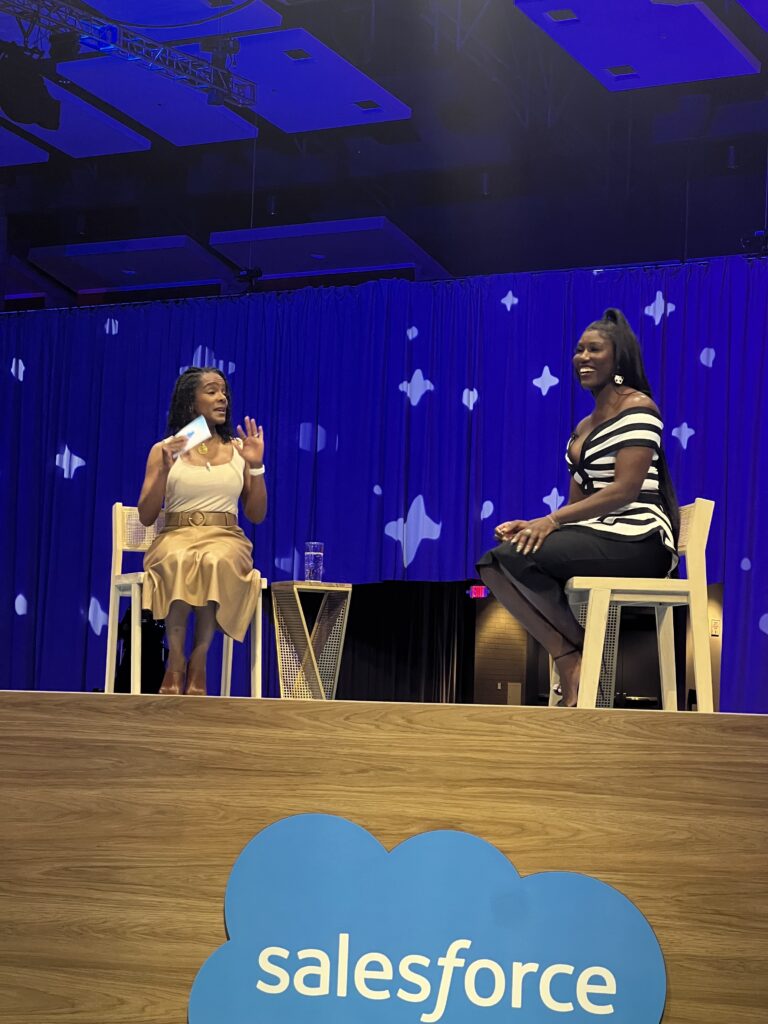 Bozomoa Saint John at the Salesforce CNX 2025 event, attended by Emilie Sanders Lee from Just Global
